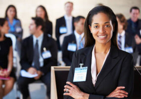 Pay monthly call answering service Businesswoman stood arms folded smiling conference